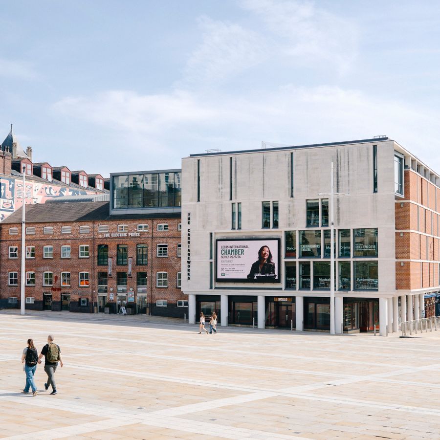 The Electric Press building and the big screen on Millennium Square in the daylight