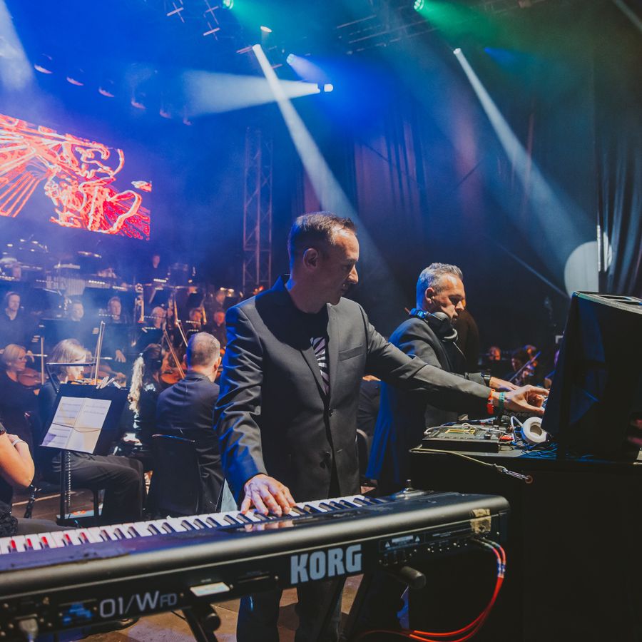 Utah Saints on stage at Millennium Square with the Orchestra of Opera North