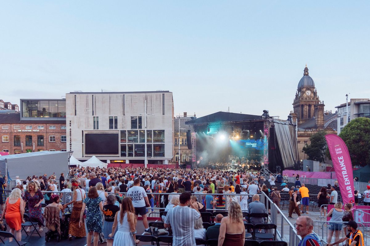 Accessible viewing platform overlooking a concert in Millennium Square.
