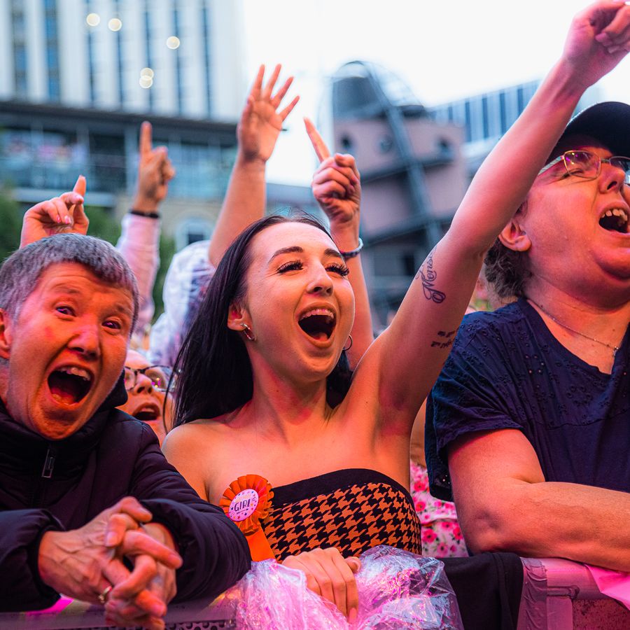 3 members of the audience enjoying the event