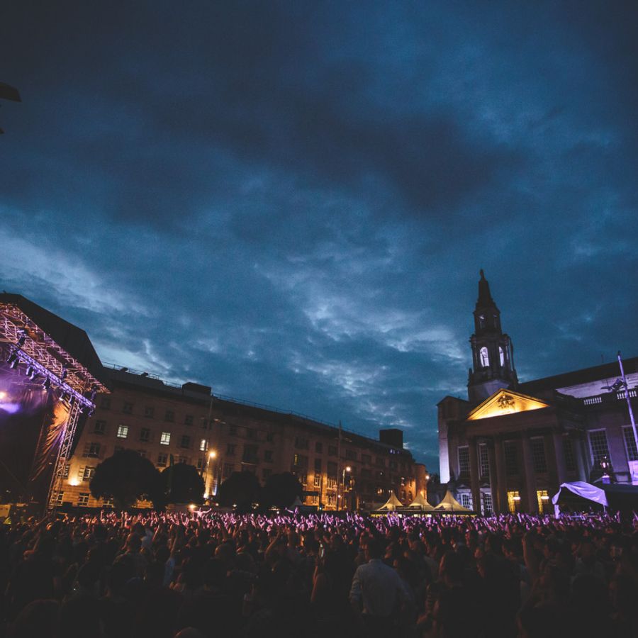 Millennium Square at night during a gig