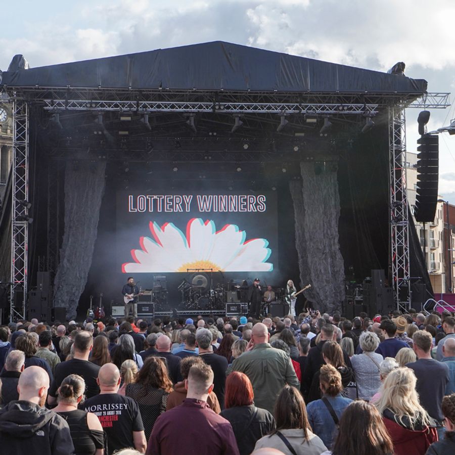 Crowd looking towards the stage at Millennium Square where Lottery Winners are performing on stage