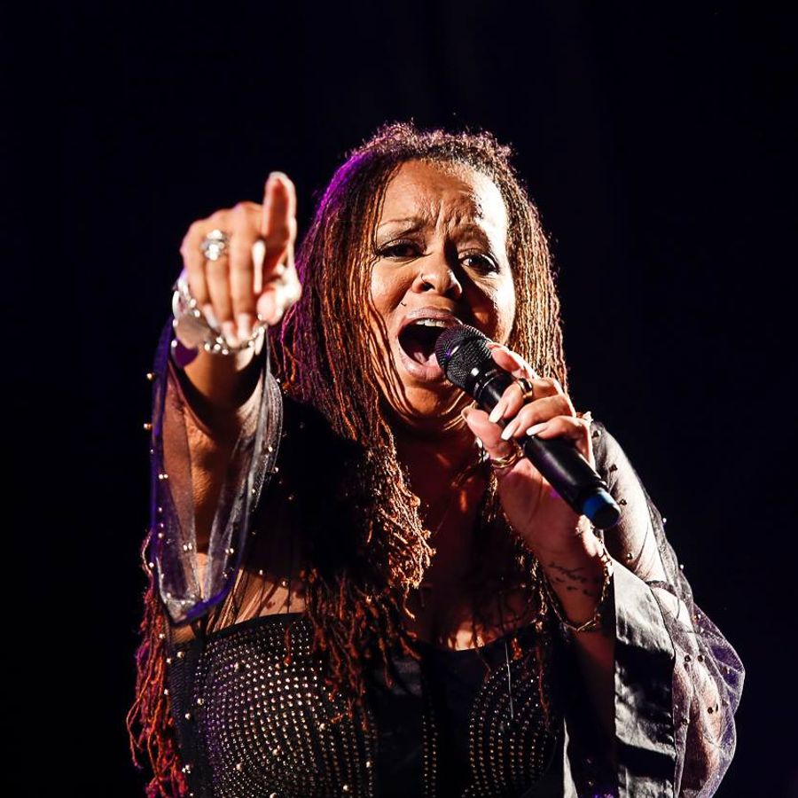 Close-up of Robin S singing whilst looking straight into the camera