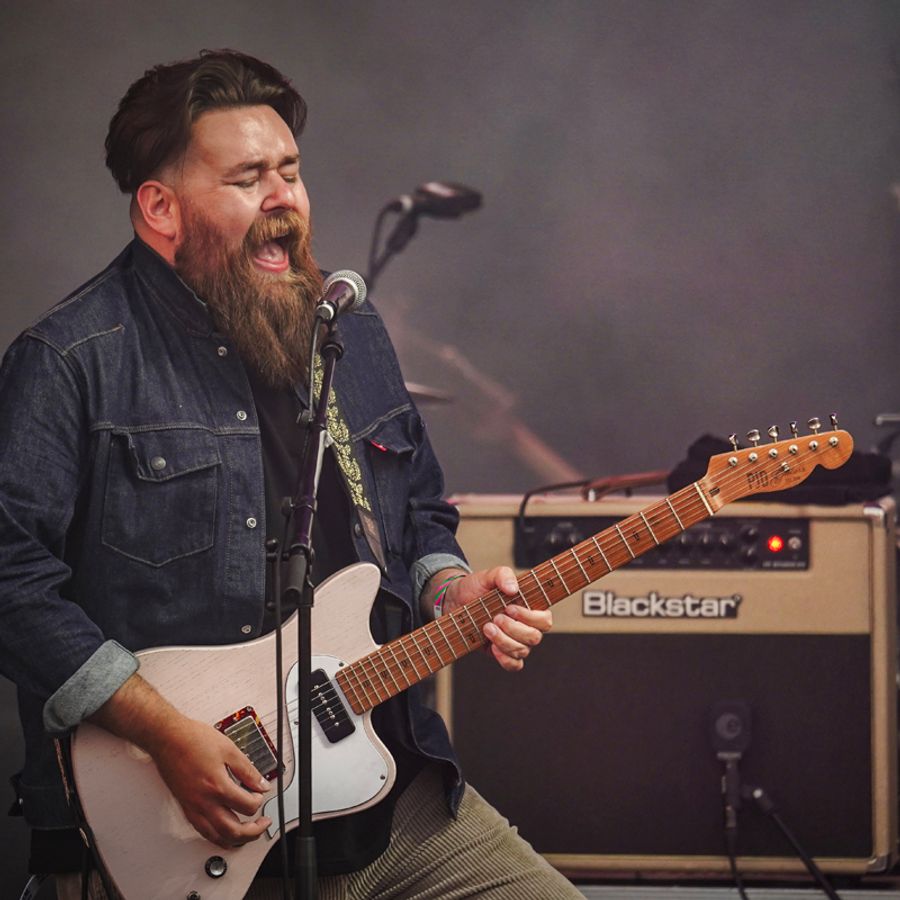 Robert Lally playing guitar on Millennium Square