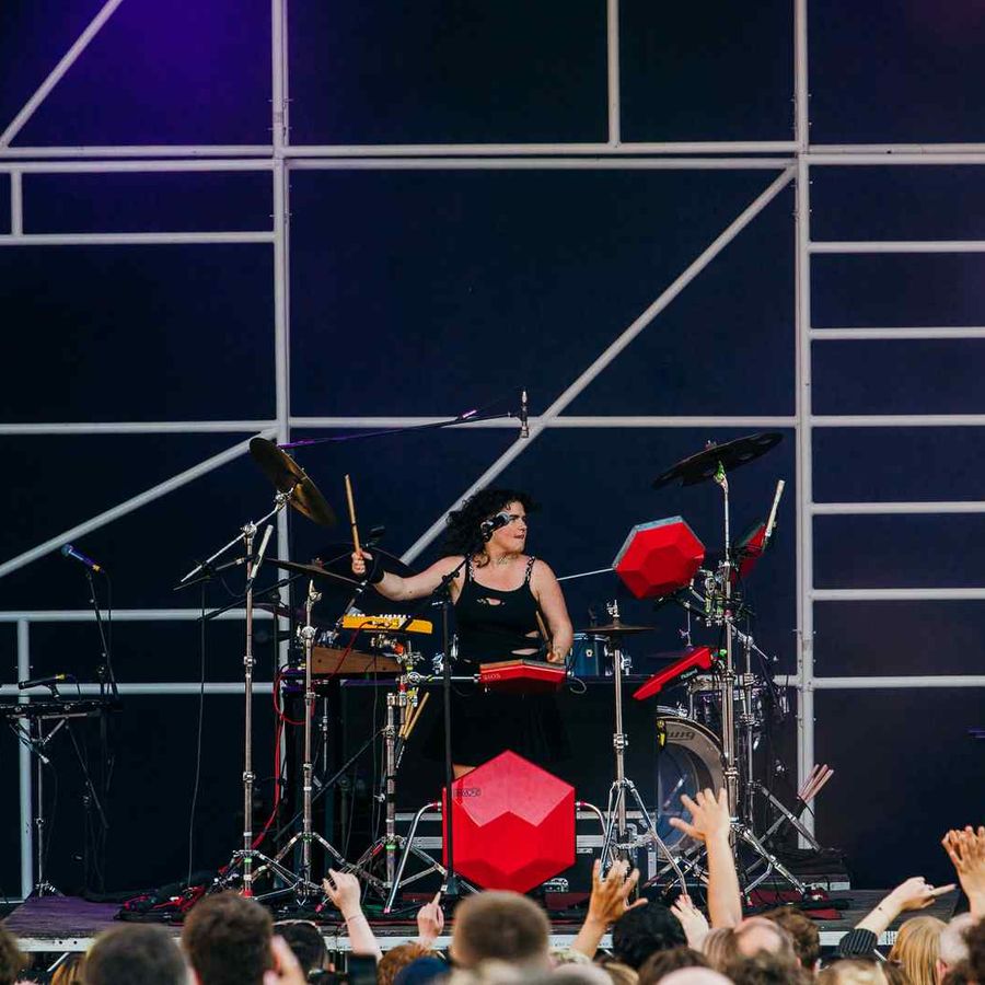 Close-up of musician on stage playing the drums