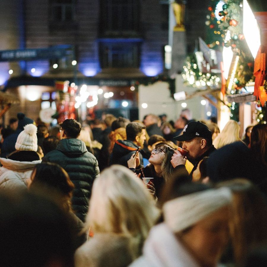 Crowds among festive stalls at Ice Cube.