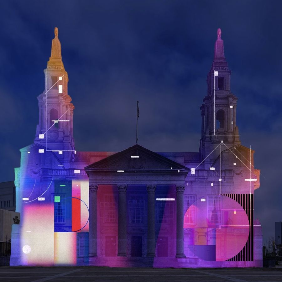 Colourful geometric light projection covering the façade of Leeds Civic Hall