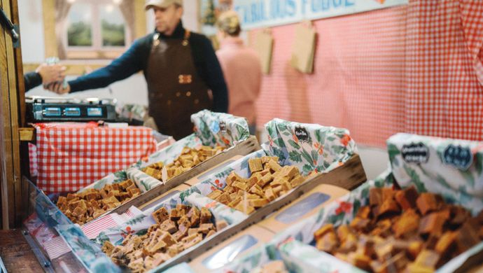 Food stall showcasing trays of fudge